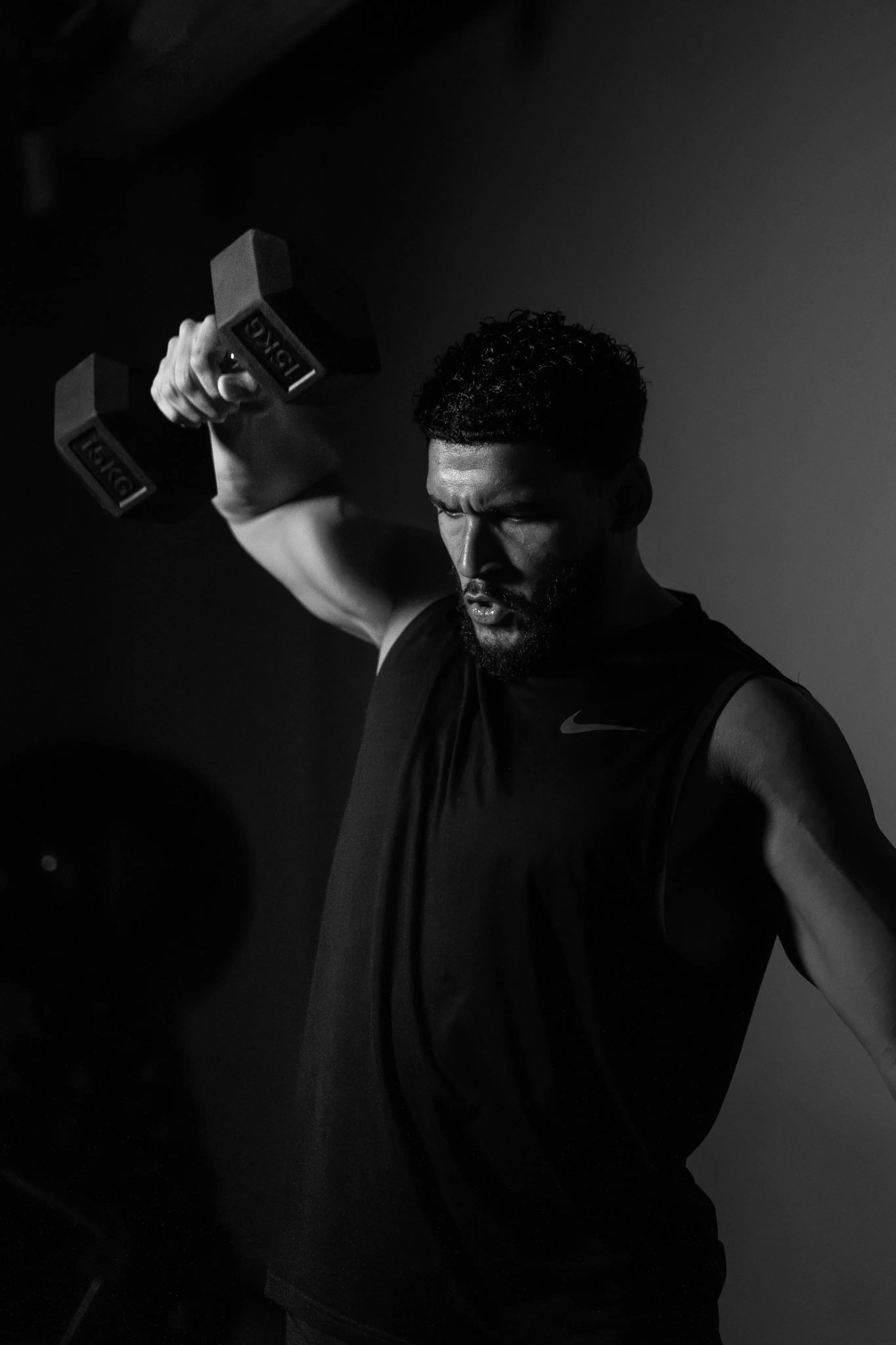 Athlete lifting dumbbells